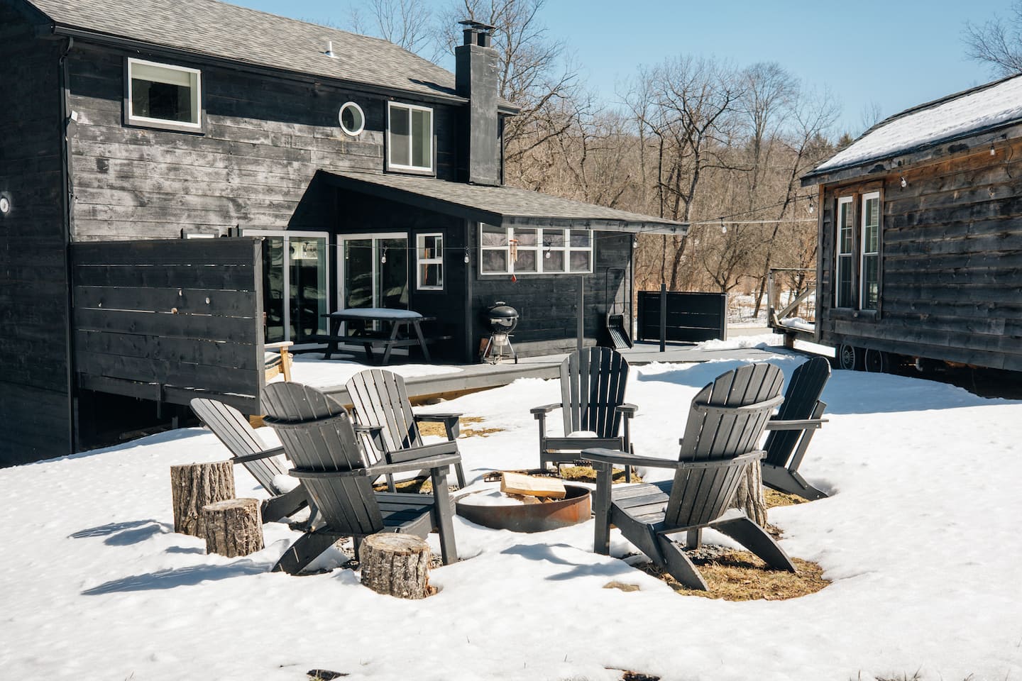 Adirondack chairs on the snowy deck